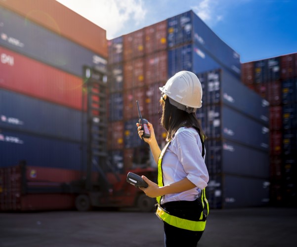 Woman foreman at cargo shipping port