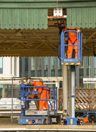 Railway construction scene trackside with workers