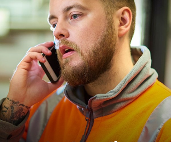 Frontline transport worker on phone