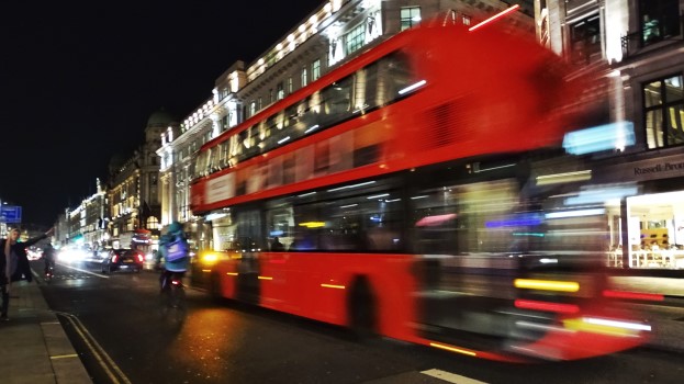 Blurry London bus at night