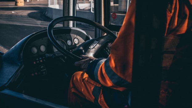 Man in PPE driving vehicle