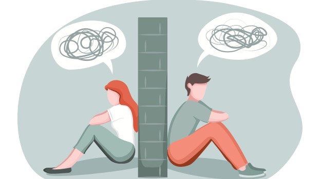 Mental wellbeing man and woman sitting with depression either side of a wall