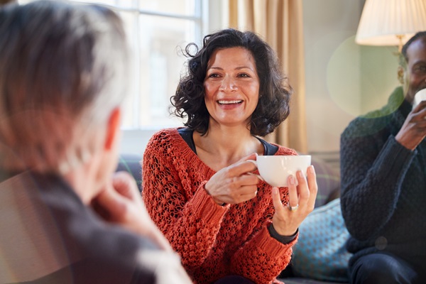 Woman enjoying a coffee with friends
