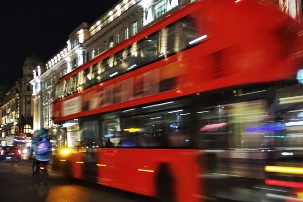 Blurry London bus at night
