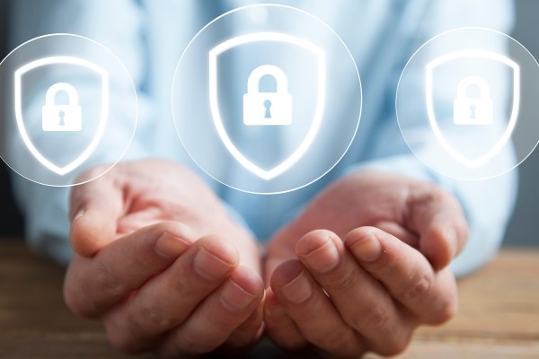 Man with hands outstretched and open in front of him with padlock symbols above showing confidentiality