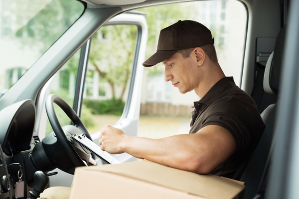 courier driver sitting inside van