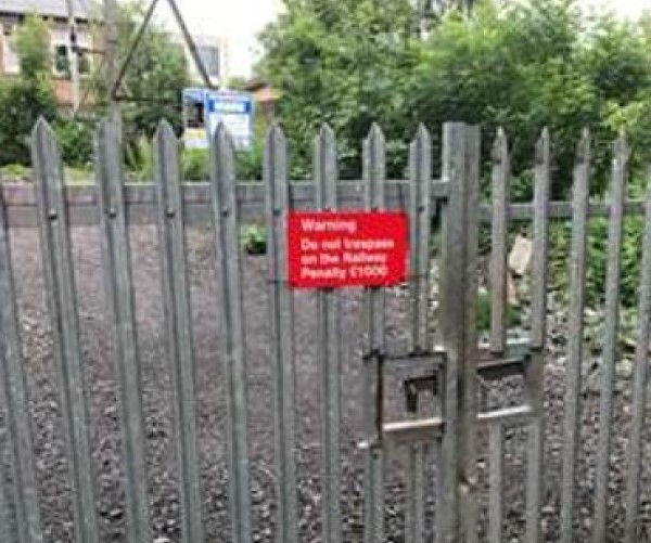 anti-trespass sign on fence