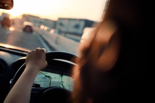 Woman driving with fatigue in a car