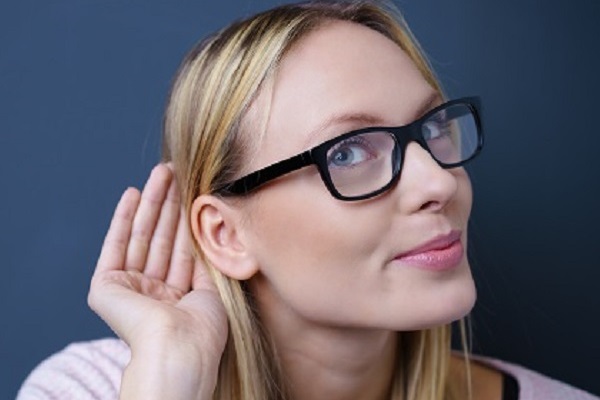 woman-holding-her-ear-to-listen