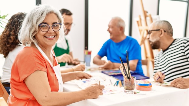 Group of friends painting and creating art as a community for their wellbeing and to prevent stress