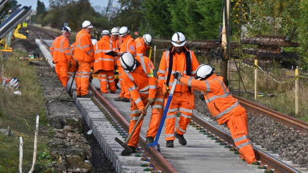 Railway track workers engineers working on track