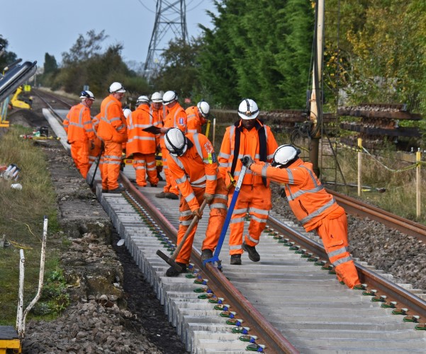 Railway track workers engineers working on track