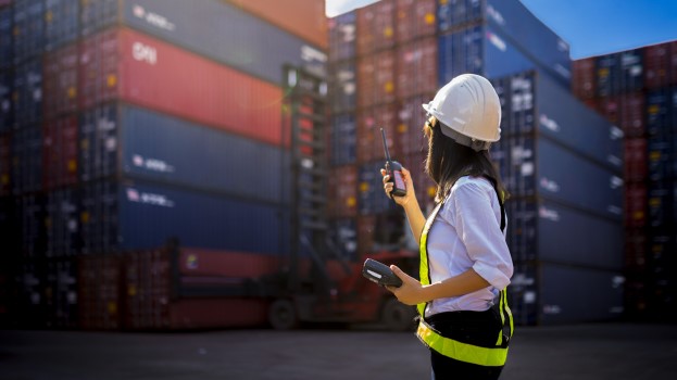 Woman foreman at cargo shipping port