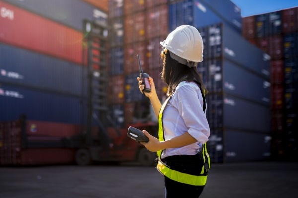 Woman foreman at cargo shipping port