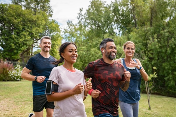 Group of men and women exercising outside