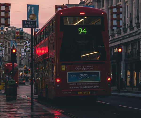 London bus driving at twilight