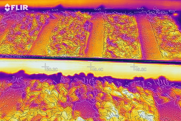 Infrared image showing heat distribution on railway tracks, with temperature readings visible.