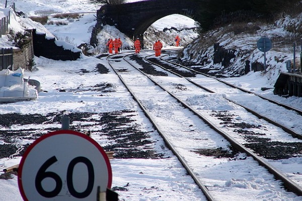 Trackside workers working in snowy conditions on the railway